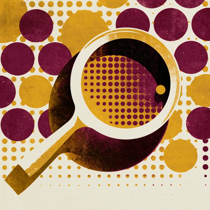 A magnifying glass held over a field of halftone dots, enlarging a few