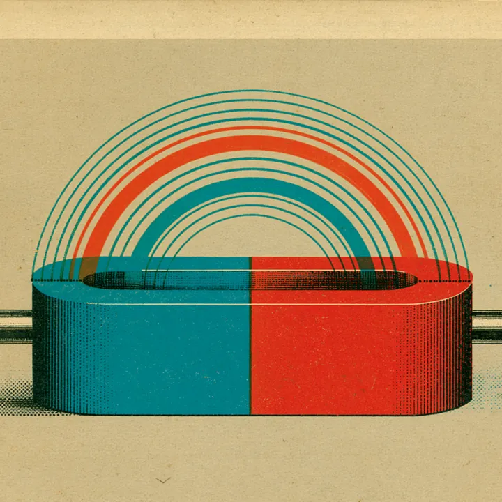 A red and teal horseshoe magnet arcing a rainbow between its poles